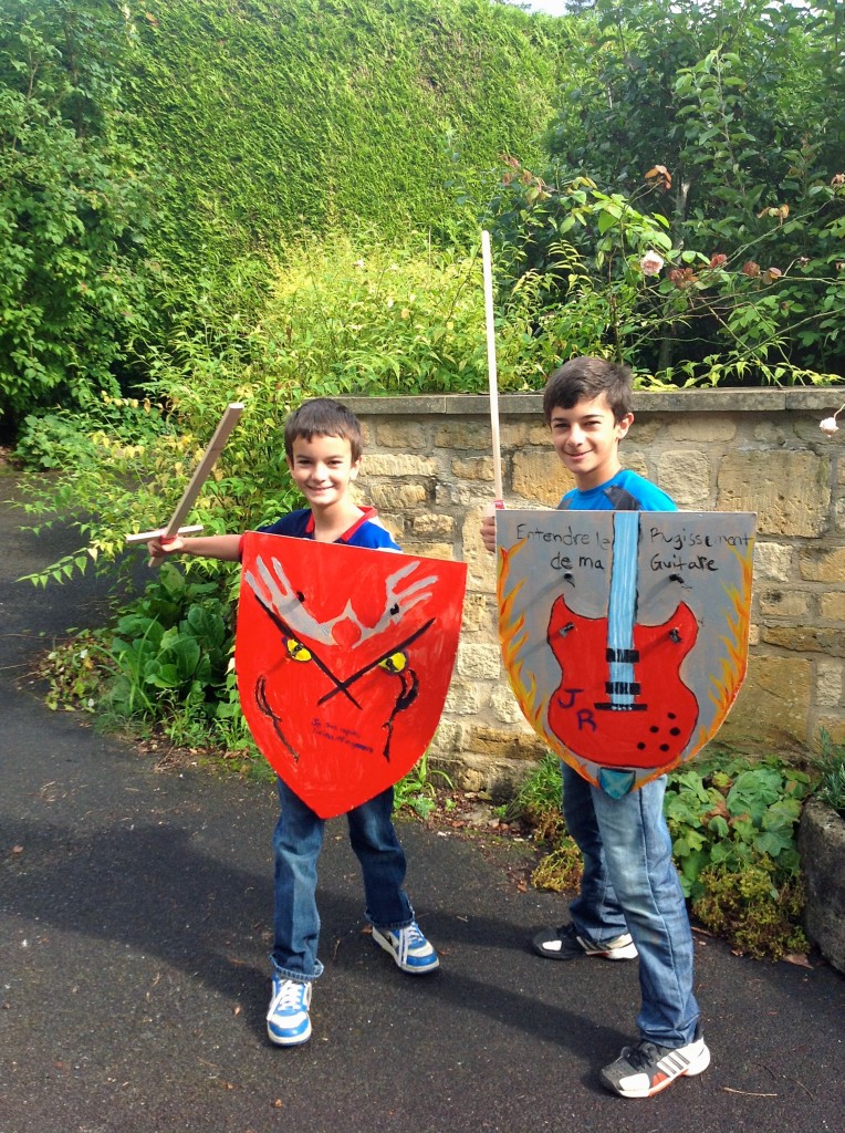 The boys wanted to buy shields and swords in the gift shop at Cardiff Castle. Better yet, we came home and they made their own. This was their art project this week, also made the social studies connection by learning about coats of arms. Justin's shield says "I am fast, furious, and dangerous." Jordan's says, "Hear the roar of my guitar." In honor of the Normans, we wrote the mottos in french.