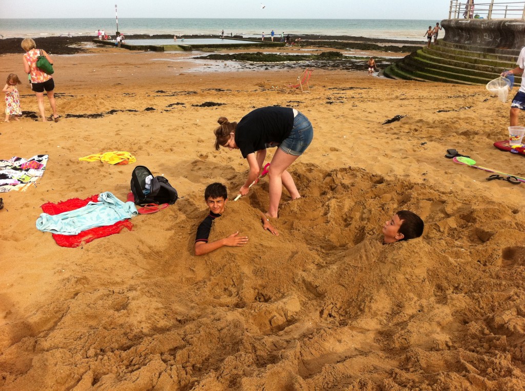 The sand was deep and damp. Perfect for digging. Jordan dug a shoulder depth hole, then filled it in with him inside. He had a heck of a time getting his legs free.